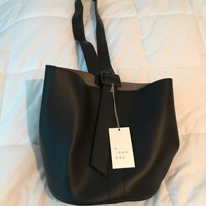 a new day bucket bag
